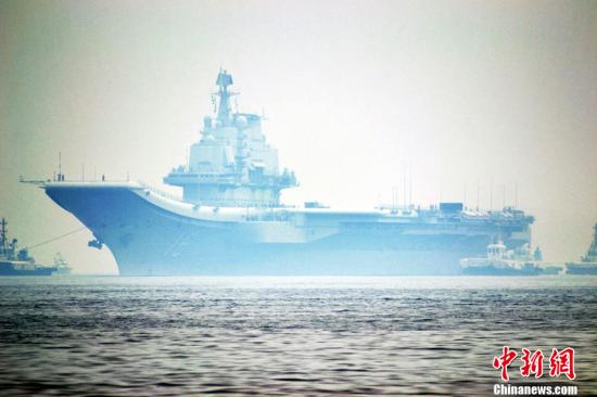 中国航母辽宁舰顺利完成试验试飞任务返回母港